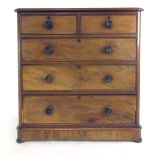 A late 19th century mahogany chest of two short over three long drawer with original turned knobs