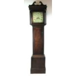 An 18th century long case clock the enamelled face with painted spandrels, Roman numerals,