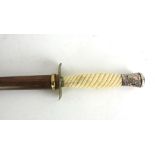 A walking stick having an ivory rope twist sword handle and silver topped pommel with hallmark,