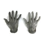 A pair of foundry cast metal hands,