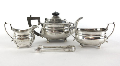 A three piece silver tea set together with a pair of silver hallmarked sugar tongs comprising of a