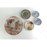 A group of Oriental ceramics including a set of ten Chinese plates decorated in bright enamels,