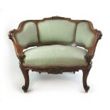 A 19th century walnut and parcel gilt French style tub chair upholstered in a green fabric,