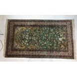 A hand woven silk Persian prayer rug,