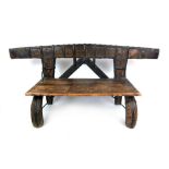 A primitive Indian metal bound bench, h. 64 cm, w. 147 cm, d.