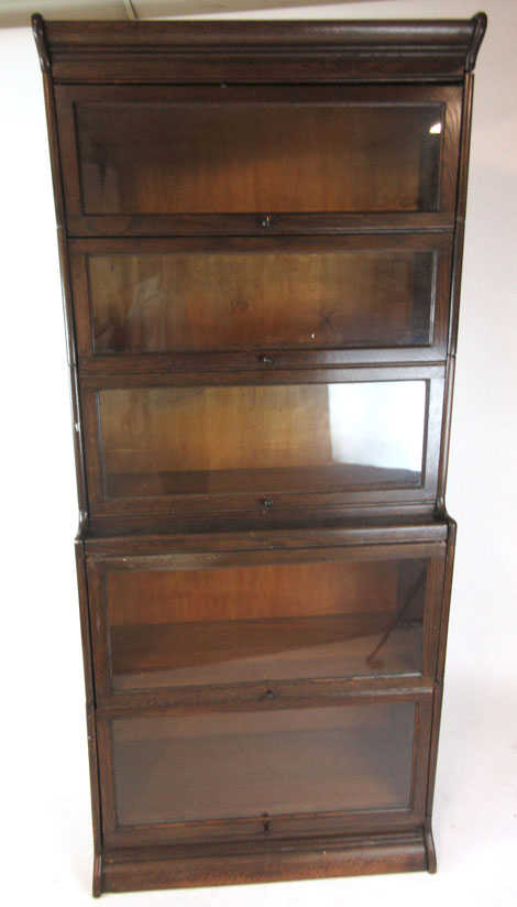 A early 20th century oak 'Gunn sectional bookcase', comprising of five bookcase sections,