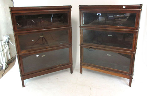 A pair of early 20th century walnut Globe-Wernicke bookcases, comprising of six glazed sections,
