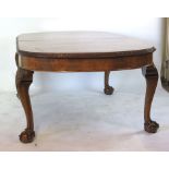 A reproduction 18th century style walnut extending dining table,