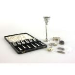 A group of silver including a single bud vase, hallmarks rubbed, a cased set of six cake knives,