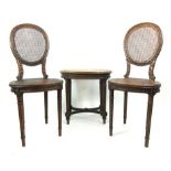 A pair of late 19th century beech and bergere chairs with associated table, h. 93 cm, w. 39 cm, d.