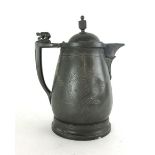 A large pewter lidded jug, with a stoneware liner,