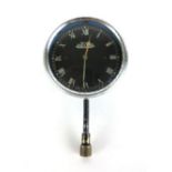 A British Jaeger car clock with a chrome surround and black face with Roman numerals, diameter 8.