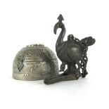 An Asian bronze hanging incense burner of a bird form, with large rear feathers,