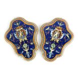 A pair of late 19th/early 20th Century Glen pottery armorial wall plaques,