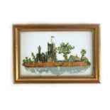 A framed collage of church scene on porcelain made with various old stamps