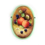 Attributed to Royal Worcester, a ceramic wall plaque decorated with fruits, signed S Walton,