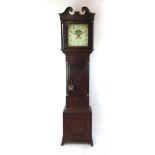 An early 19th century oak long case clock with swan neck pediment over enamelled face with painted