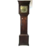 An 18th century oak long case clock the brass and silvered face with Roman numerals,