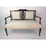 An Edwardian mahogany boxwood line inlaid and satinwood banded two seat settee upholstered in a