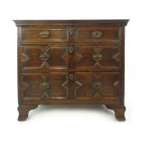 A late 17th century and later oak chest of three long drawers on later feet, h. 82 cm, w.