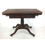 An early 19th century mahogany tea table,