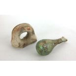 A Roman glass tear shaped scent bottle, with remnants of gilt decoration l.10.