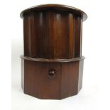 A Victorian circular step commode with tooled leather insert to top over fluted sides and pull out