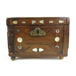 A 19th century folk art mahogany tea caddy inlaid with mother of pearl, brass, boxwood, rosewood,