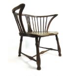 A late 18th century and later elm comb back Windsor chair with a burr elm seat on turned legs and