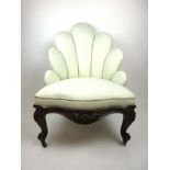 A Victorian rosewood fan back bedroom chair upholstered in a white gold fabric with a serpentine