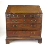 A late 18th century oak bureau,