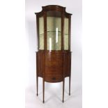 An Edwardian satinwood and ebony strung bow fronted display cabinet,