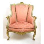 An early 20th century grey painted and parcel gilt salon chair upholstered in a floral pink fabric