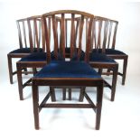 A set of six Georgian mahogany dining chairs with blue cut fabric on pad seats, h. 90 cm, w.