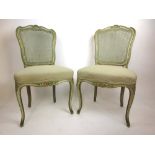 A pair of 19th century French Painted and parcel gilt side chairs with bergere back over a cream