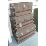 TRUNKS, a set of three, Hessian with wooden studded batons with silver studwork and locks,