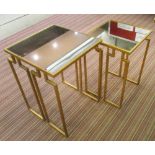 NEST OF TABLES, two, Art Deco design, gilt metal base with mirrored top.