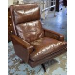 EASY ARMCHAIR, 1970's, mushroom brown leather cushion, revolving on rosewood five star base.