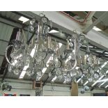 CHANDELIERS, a pair, circa 1950, nickel plated of six lights with roundel glass pendants and drops,