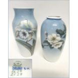 ROYAL COPENHAGEN VASES, two, both decorated a flower study on a powder blue ground,