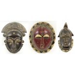 GURO RED FESTIVAL MASK, painted and carved wood, 28cm H; and two Baule ceremonial masks,