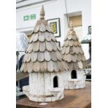 DOVECOTES, a pair, slatted wooden roofs and barrel formed bases, 80cm H.