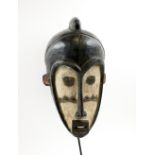 FANG NGIL FACE MASK, West African, carved wood with whitened detail, 46cm H x 26cm W max,