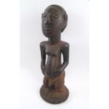HEMBA MALE FIGURE, D.R. Congo, carved wood with traces of paint, 63cm H.