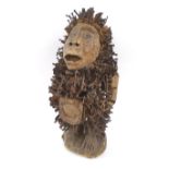 YOMBE FETISH FIGURE, carved wood with traces of paint, impaled with nails and shards of metal,