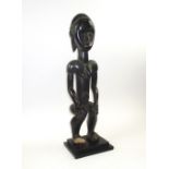 FANG FIGURE CARVING, carved wooden study of woman in crouching pose, 58cm H, detached block base.