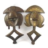 WEST AFRICAN RELIQUARIES, two similar, Kota people, metal clad carved wood, each approx.