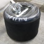 OCCASIONAL TABLE, constructed from repurposed Formula 1 racing tire,