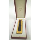 MUST DE CARTIER PARFUM PURSE SPRAY GOLD PLATED AND BLACK, 9.25cm H, with original box.