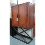 PULLMAN DRINKS CABINET, leather trunk on metal stand, 121cm W x 51cm D x 186cm H.